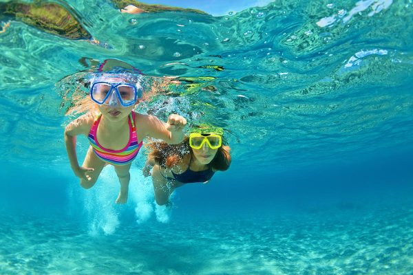 children-snorekling-in-blue-lagoon-near-split