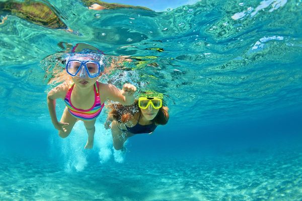 children-snorekling-in-blue-lagoon-near-split