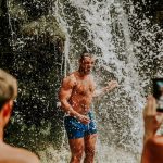 showering under Krka waterfall