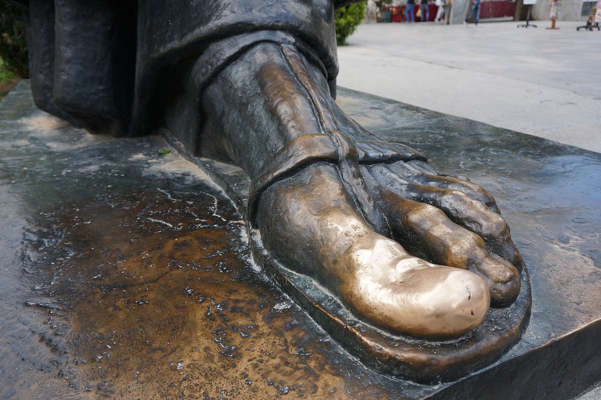 golden toe of Gregory Nin statue in Split